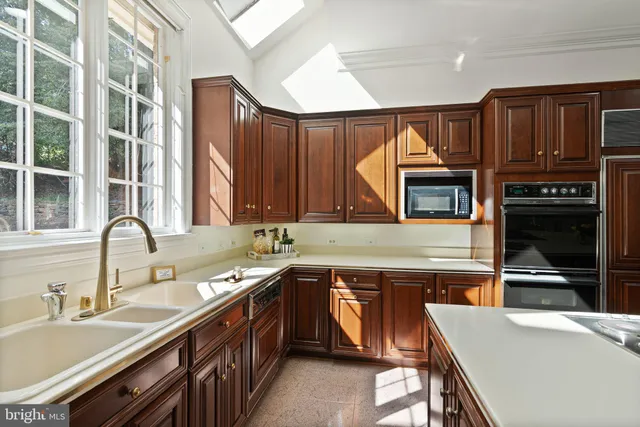 a view of staircase with railing and white walls