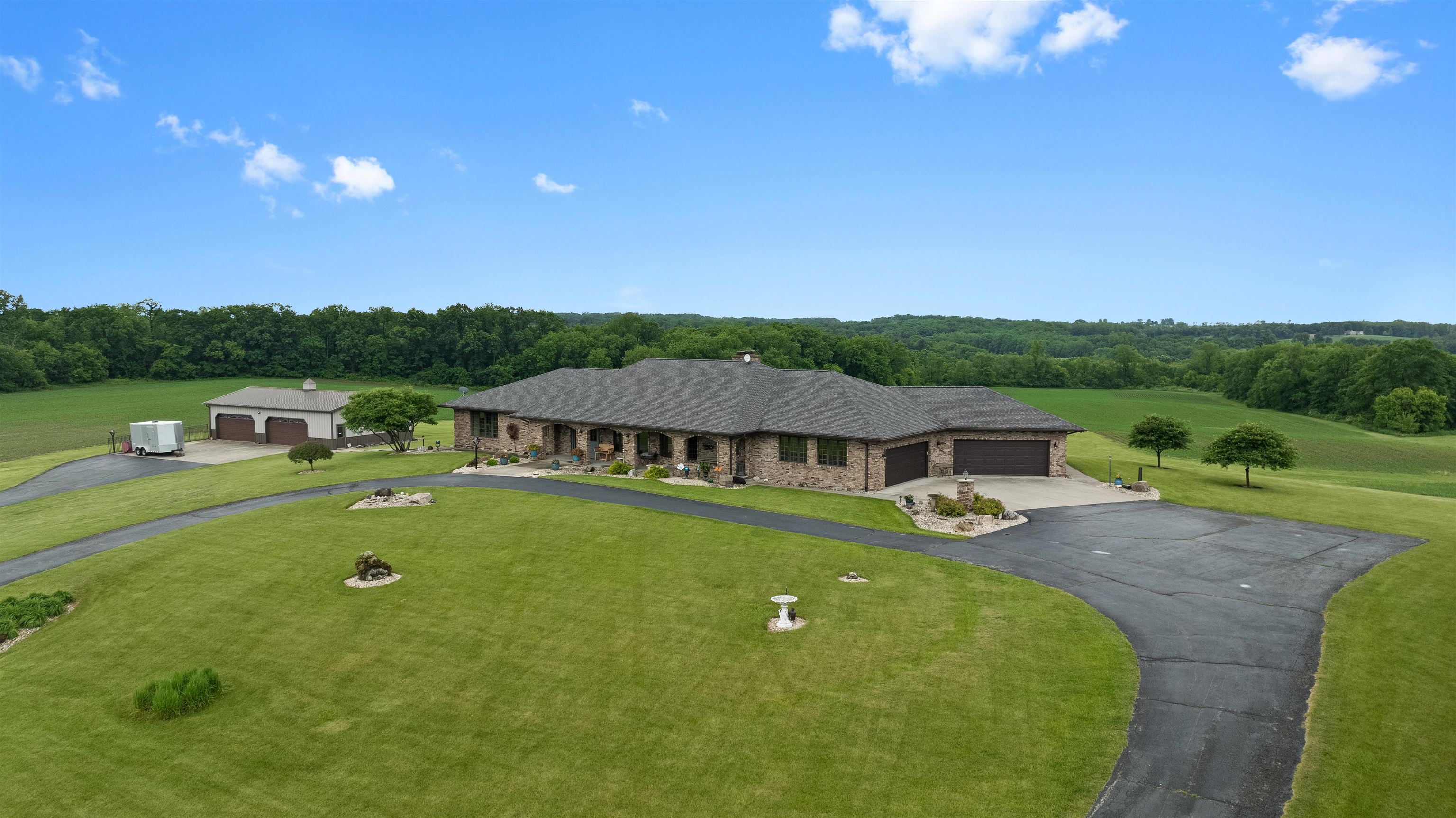 2765 West Pines Road Oregon, IL 61061 - Photo 1 of 79 an aerial view of a house with swimming pool garden and mountain view