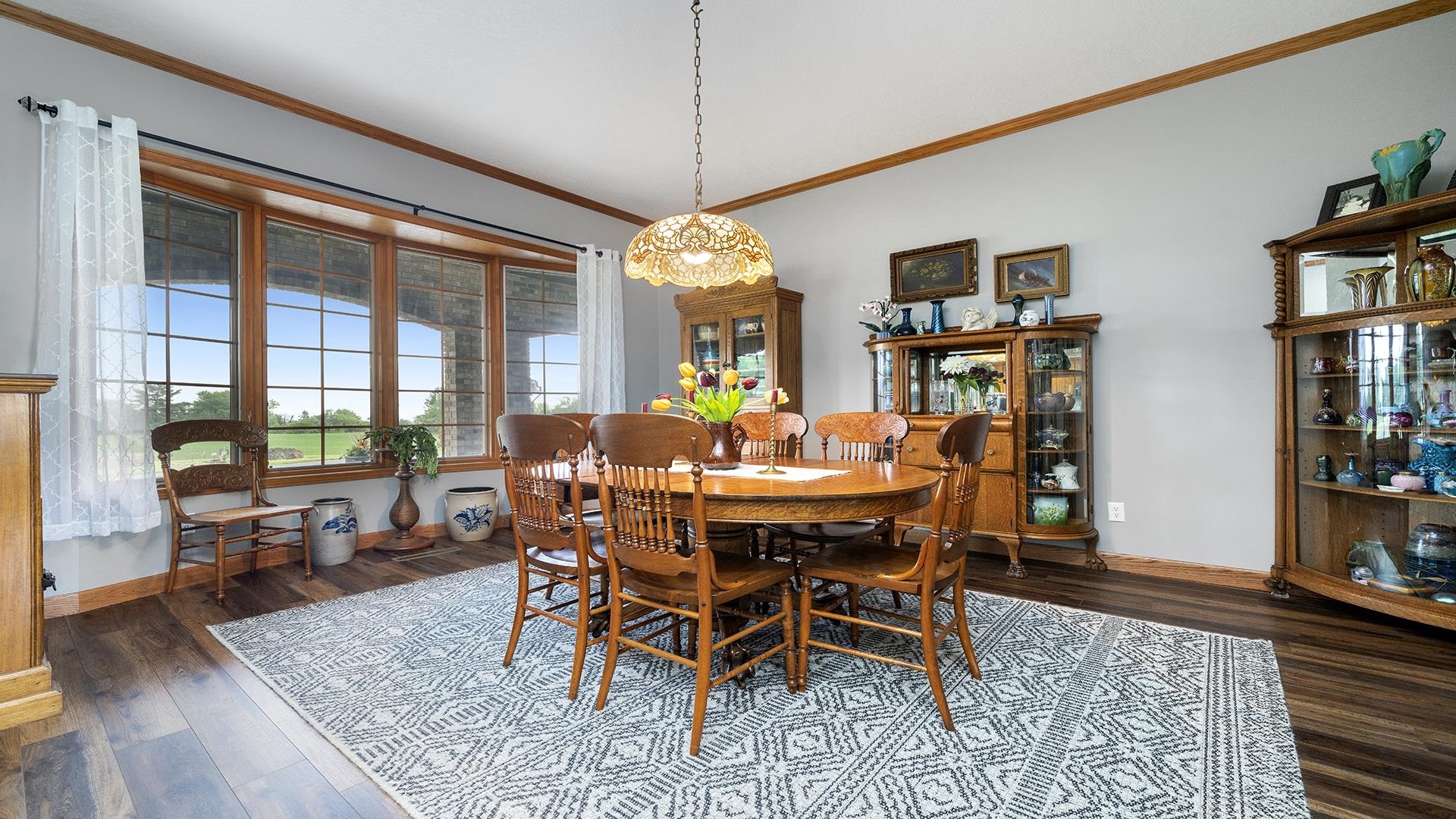 2765 West Pines Road Oregon, IL 61061 - Photo 17 of 79 a view of a dining room with furniture window and wooden floor
