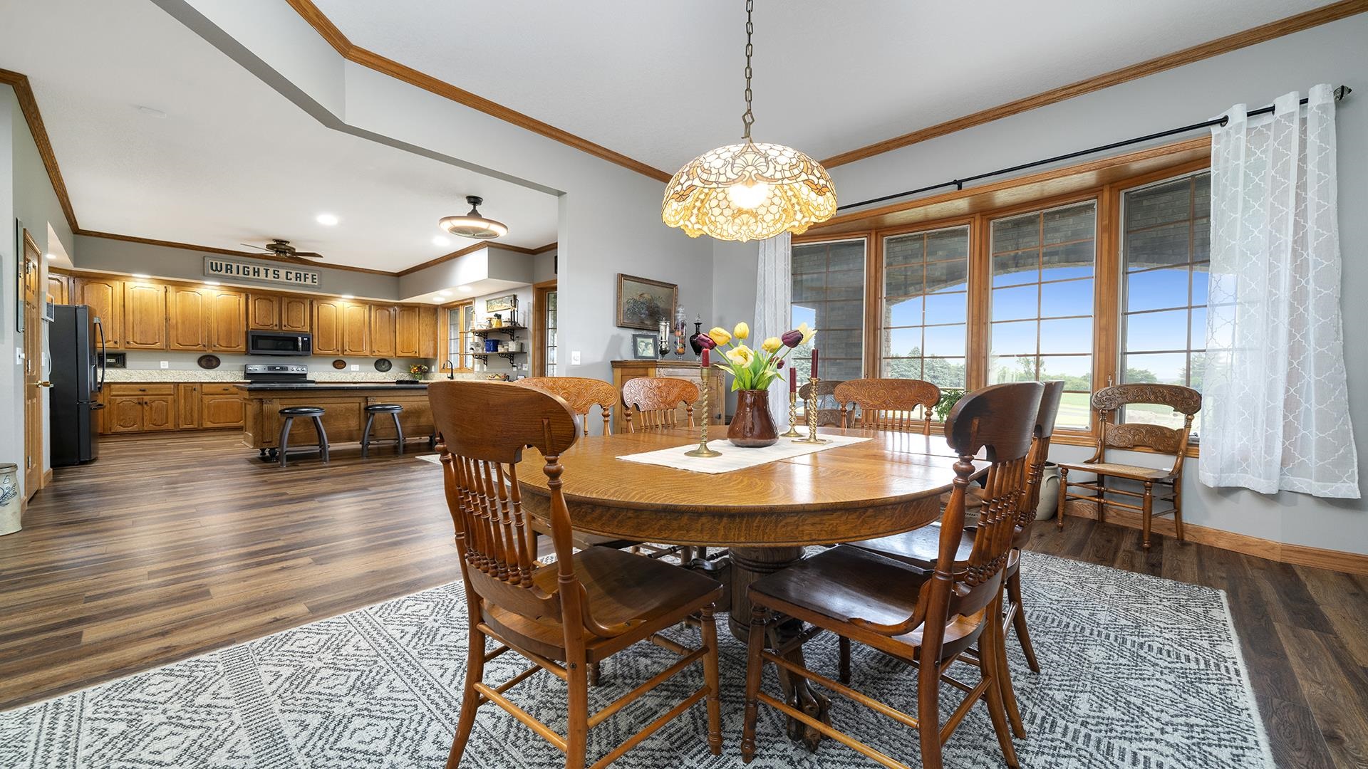 2765 West Pines Road Oregon, IL 61061 - Photo 18 of 79 a view of a dining room with furniture window and wooden floor