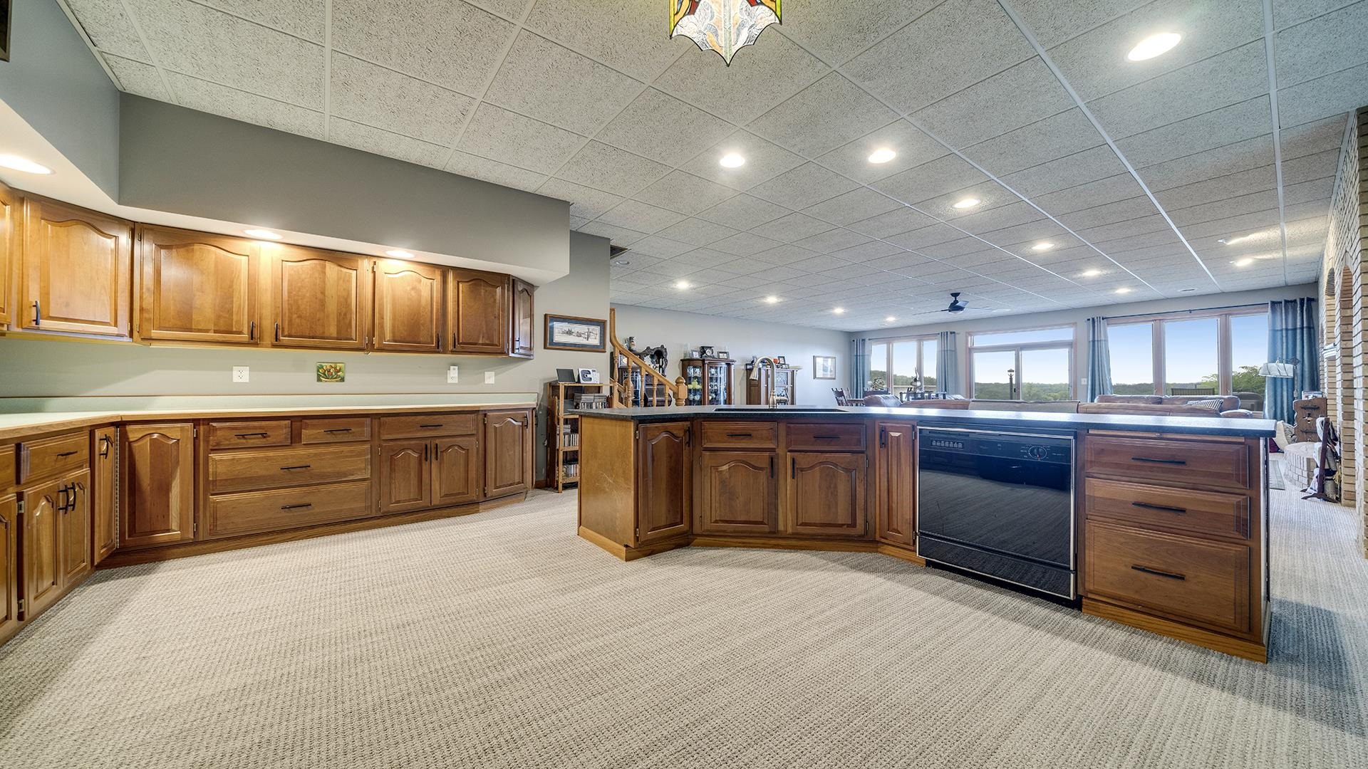 2765 West Pines Road Oregon, IL 61061 - Photo 20 of 79 a kitchen with stainless steel appliances kitchen island granite countertop a stove sink and cabinets