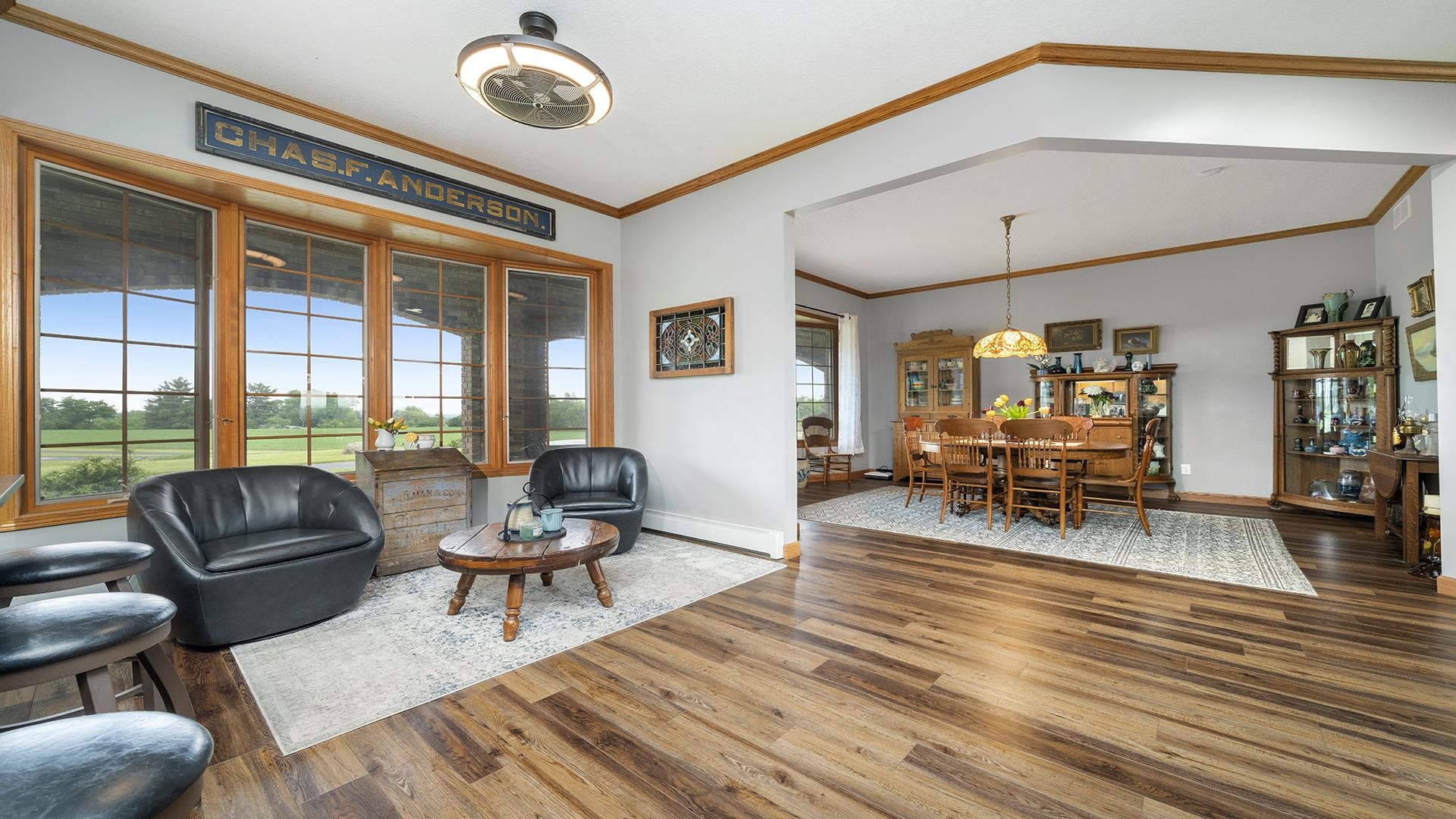 2765 West Pines Road Oregon, IL 61061 - Photo 23 of 79 a living room with furniture and floor to ceiling windows