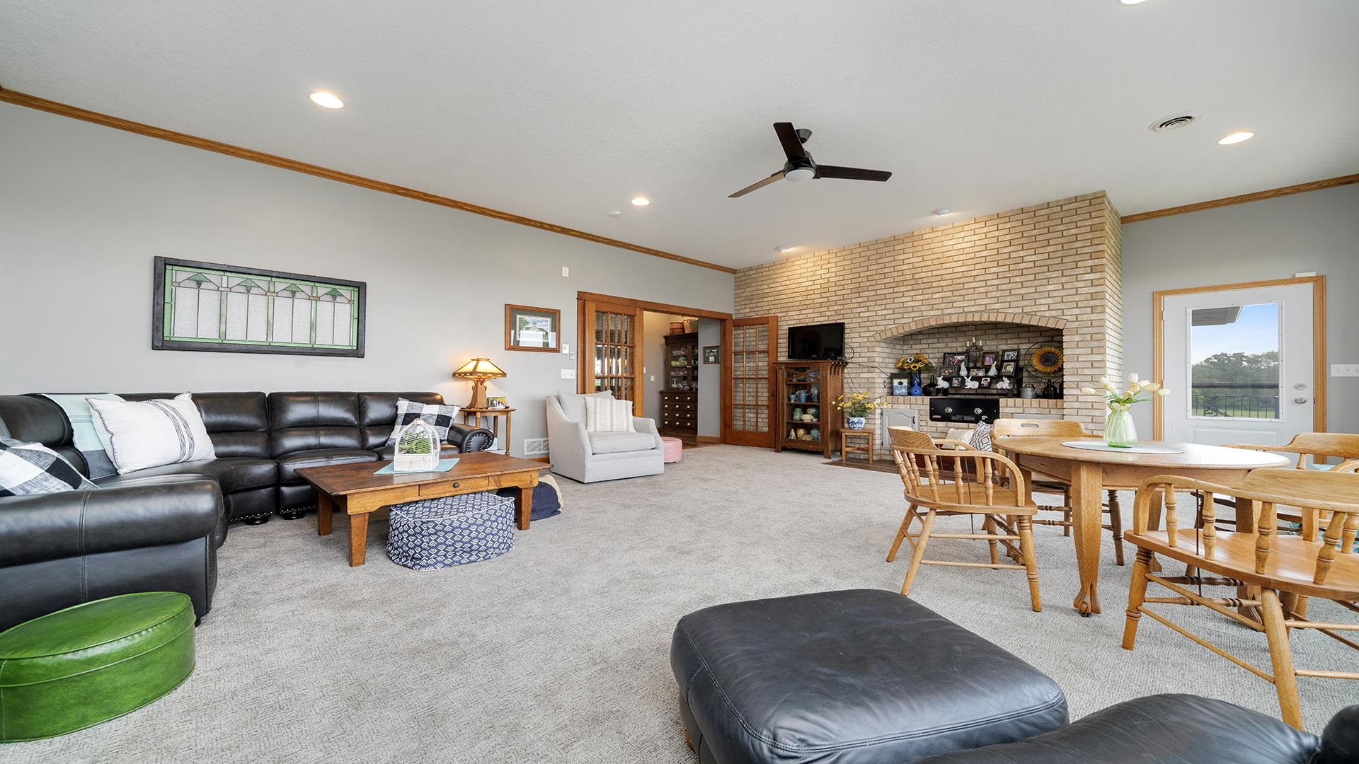 2765 West Pines Road Oregon, IL 61061 - Photo 28 of 79 a living room with furniture kitchen view and a large window