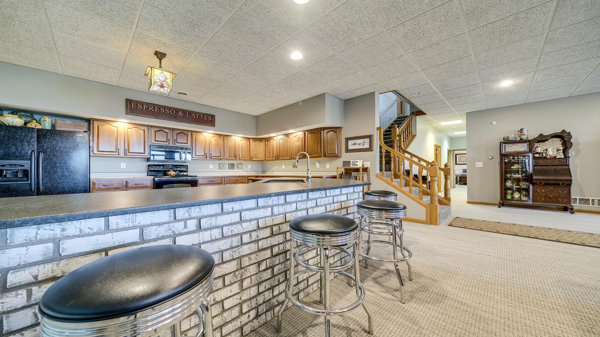 2765 West Pines Road Oregon, IL 61061 - Photo 42 of 79 a kitchen with stainless steel appliances kitchen island granite countertop a sink and cabinets