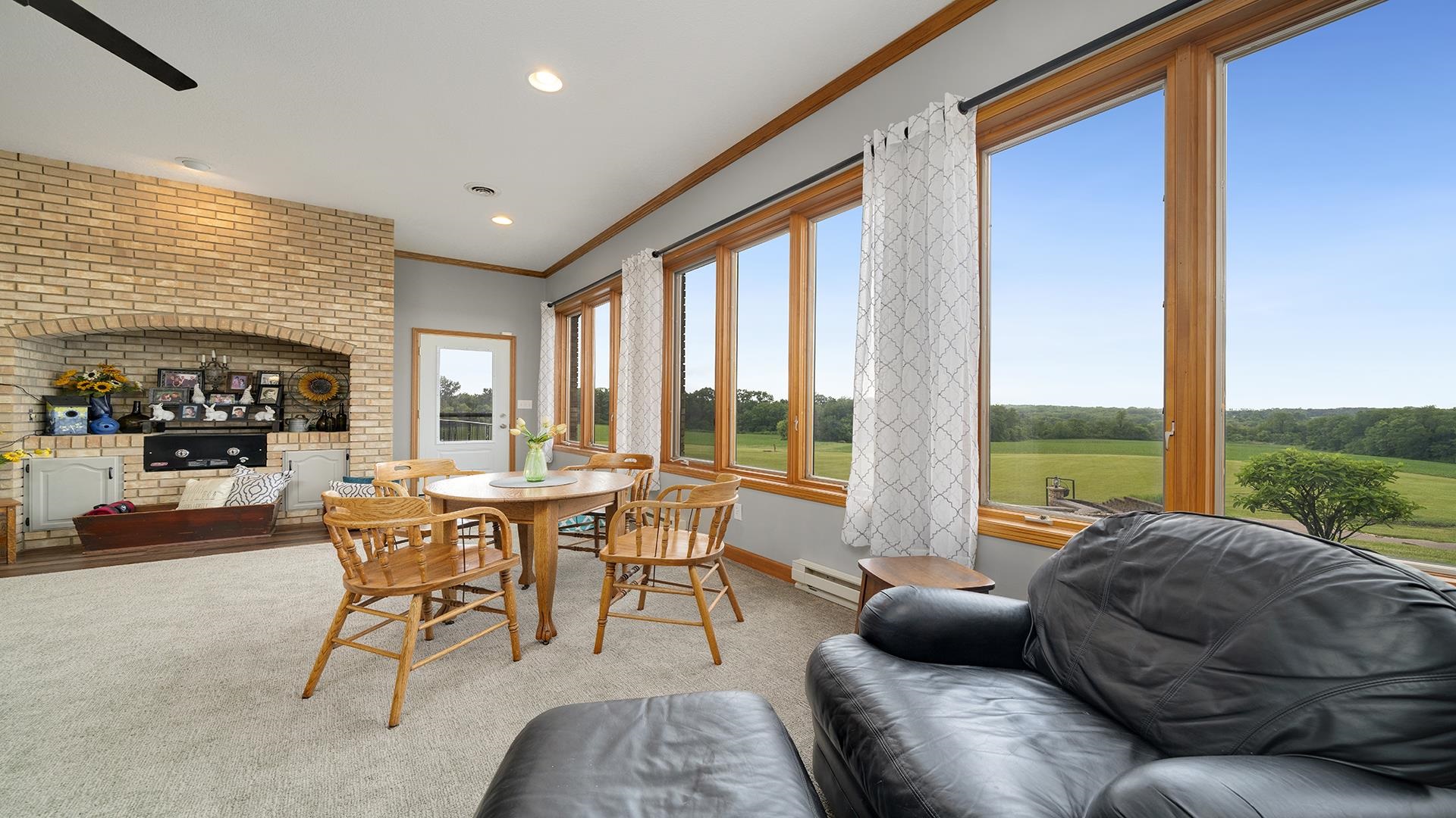 2765 West Pines Road Oregon, IL 61061 - Photo 6 of 79 a living room with furniture and floor to ceiling windows
