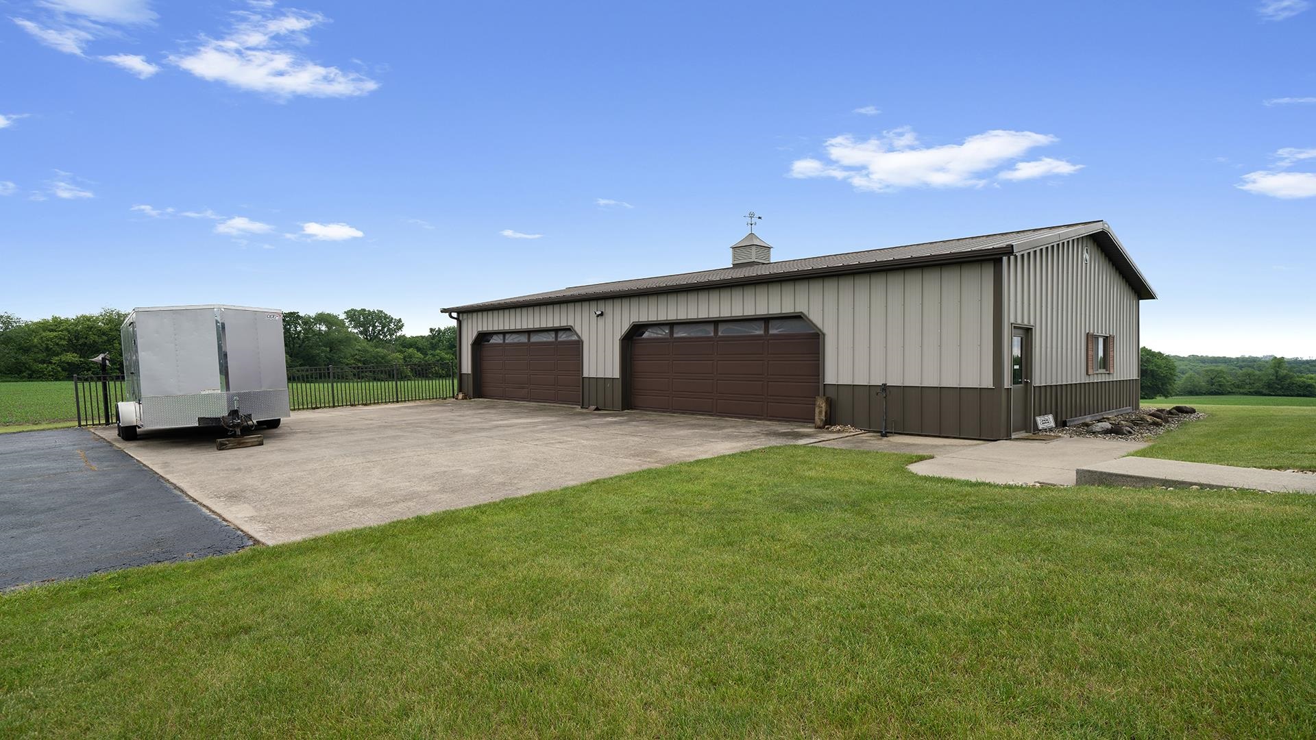 2765 West Pines Road Oregon, IL 61061 - Photo 66 of 79 a front view of a house with a garden and yard