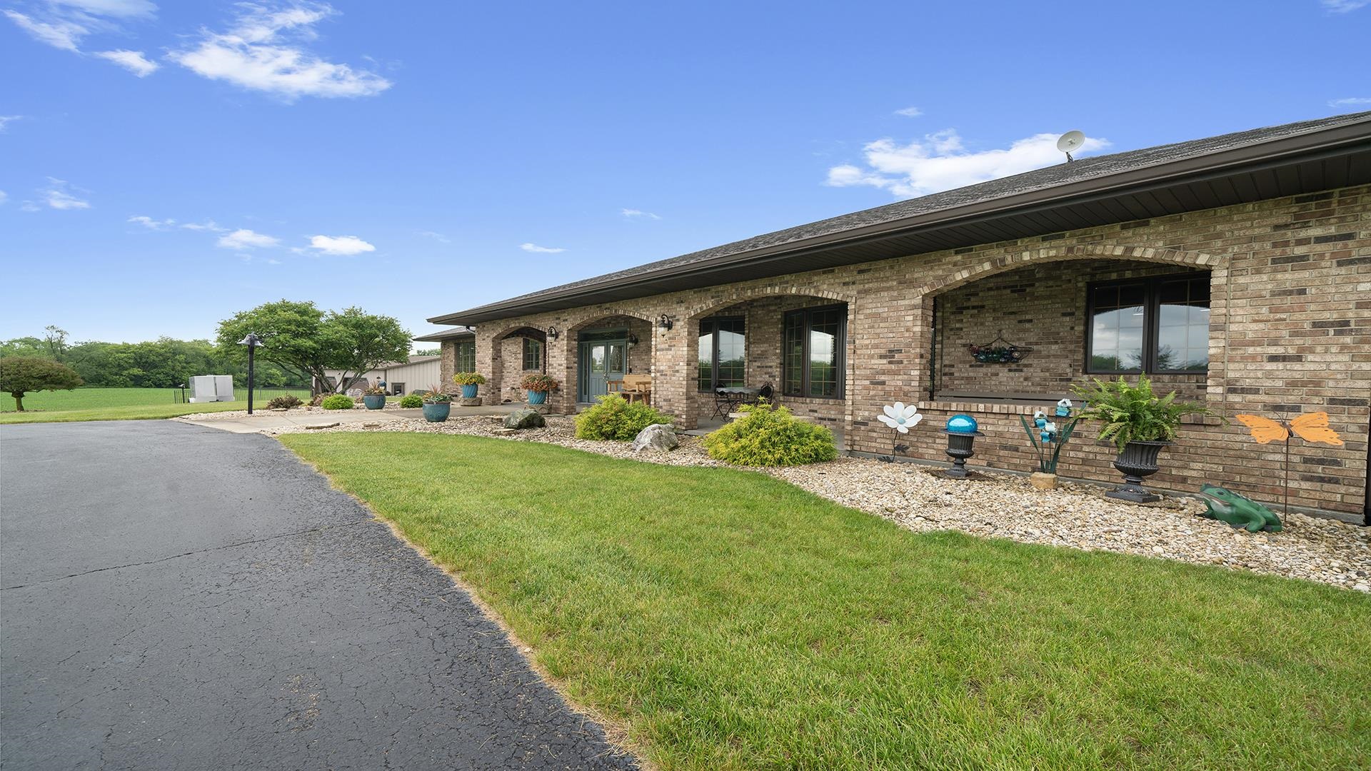 2765 West Pines Road Oregon, IL 61061 - Photo 68 of 79 a front view of house with yard and outdoor seating