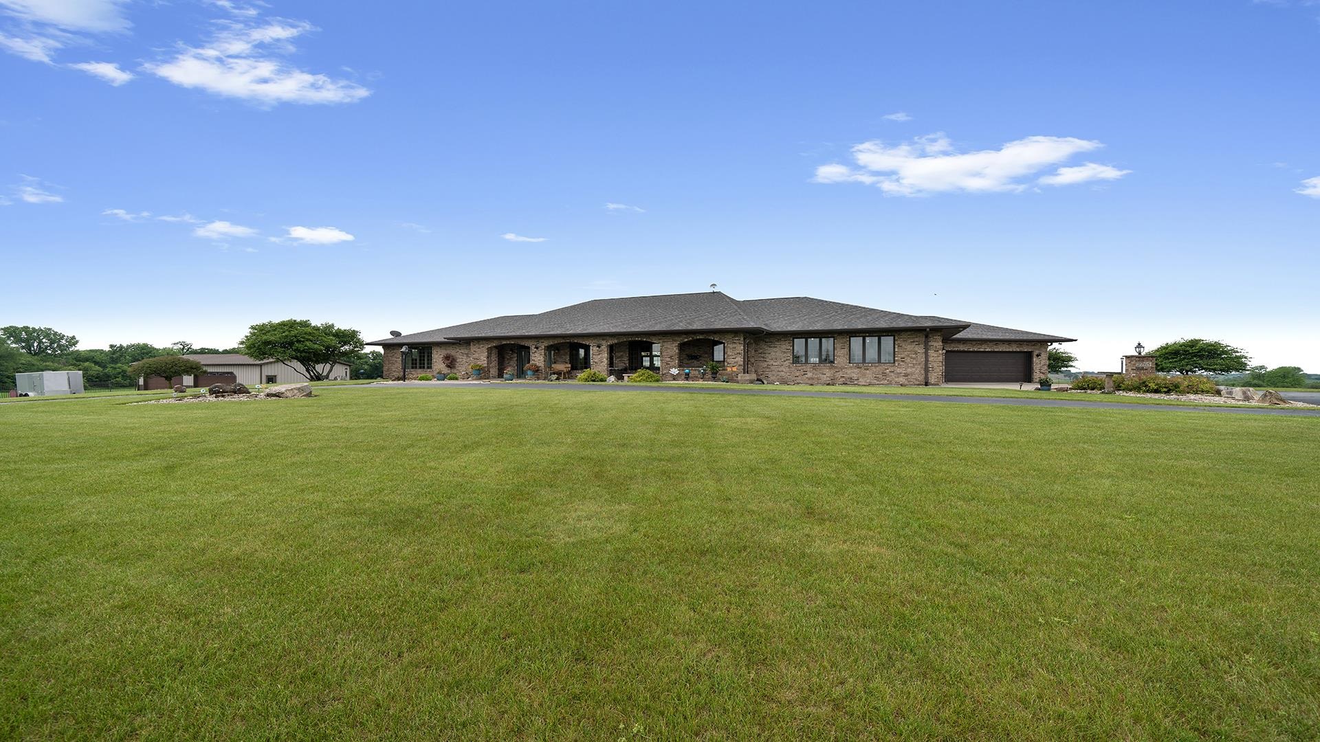 2765 West Pines Road Oregon, IL 61061 - Photo 70 of 79 a house view with swimming pool in front of it