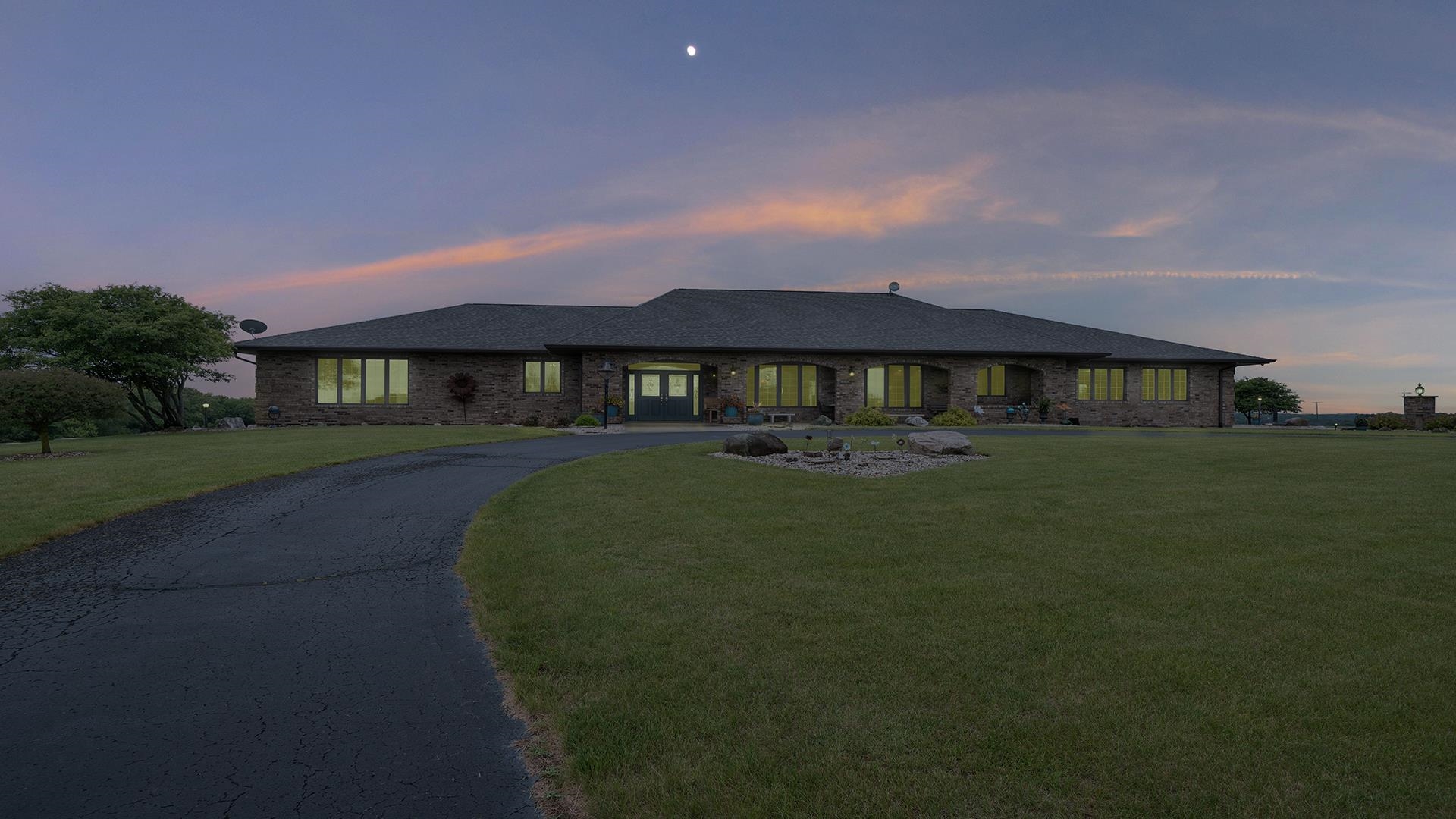 2765 West Pines Road Oregon, IL 61061 - Photo 71 of 79 a front view of a house with a garden
