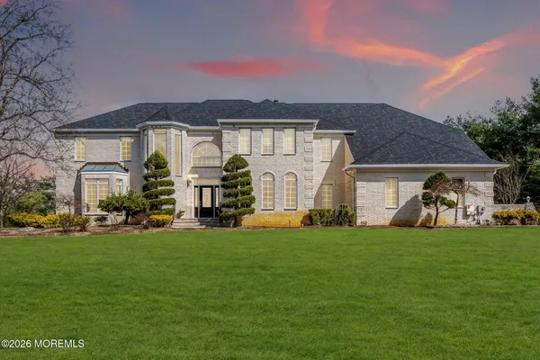 a front view of a house with a yard