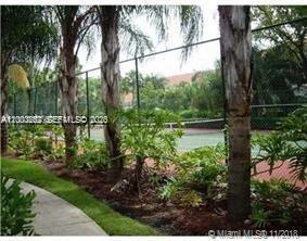620 South Park Road, Unit 312 Hollywood, FL 33021 - Photo 13 of 20 a view of a lake with a house in the background