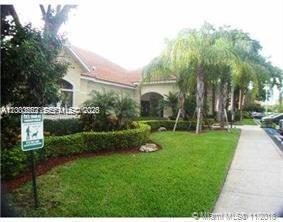 620 South Park Road, Unit 312 Hollywood, FL 33021 - Photo 14 of 20 a view of a house with backyard and a garden