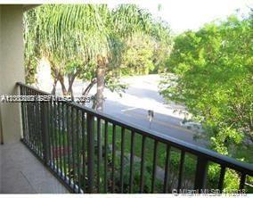620 South Park Road, Unit 312 Hollywood, FL 33021 - Photo 9 of 20 a balcony with trees in front of it