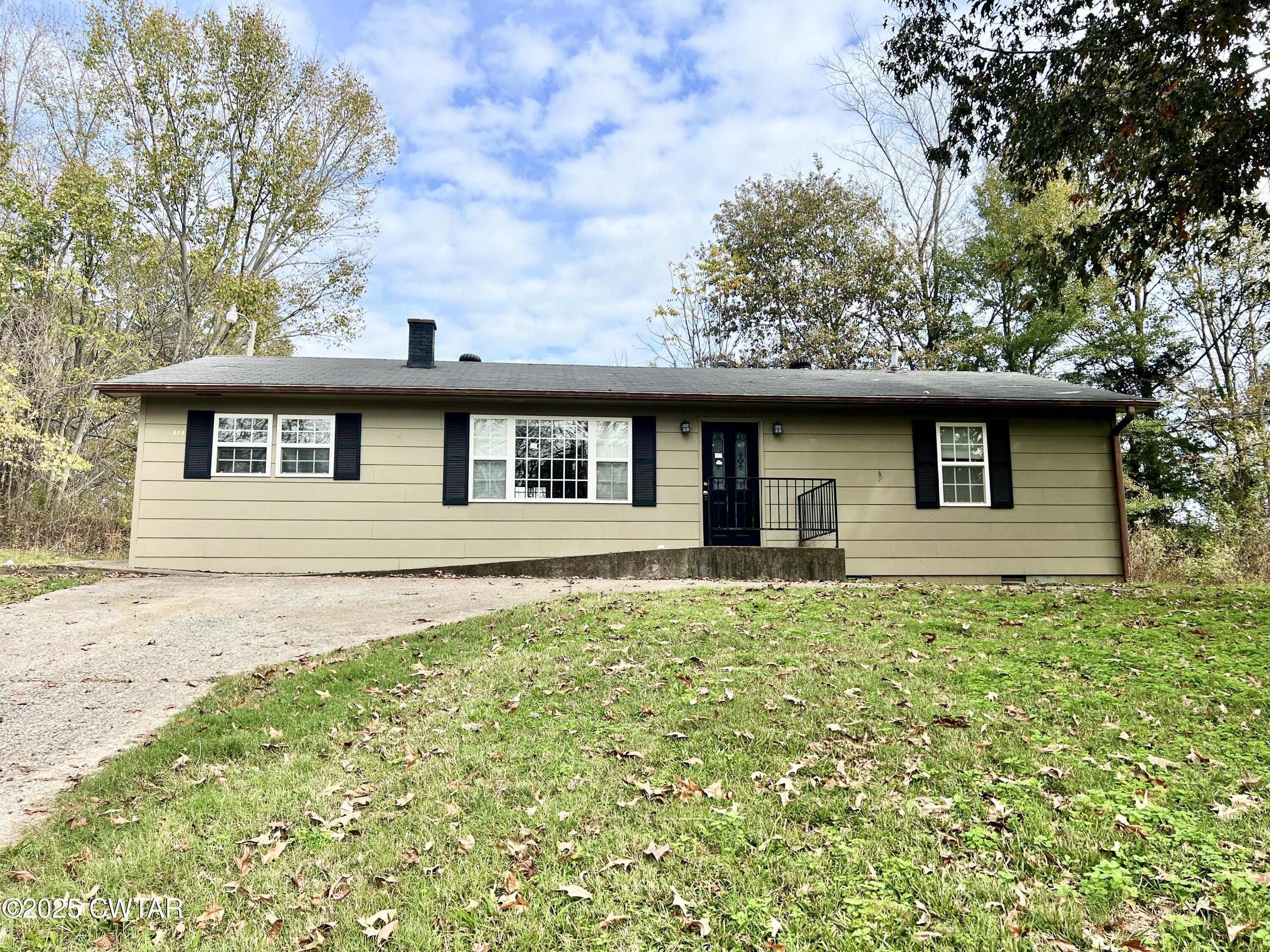808 Barlow Road Ripley, TN 38063 - Photo 1 of 13 a front view of a house with a garden