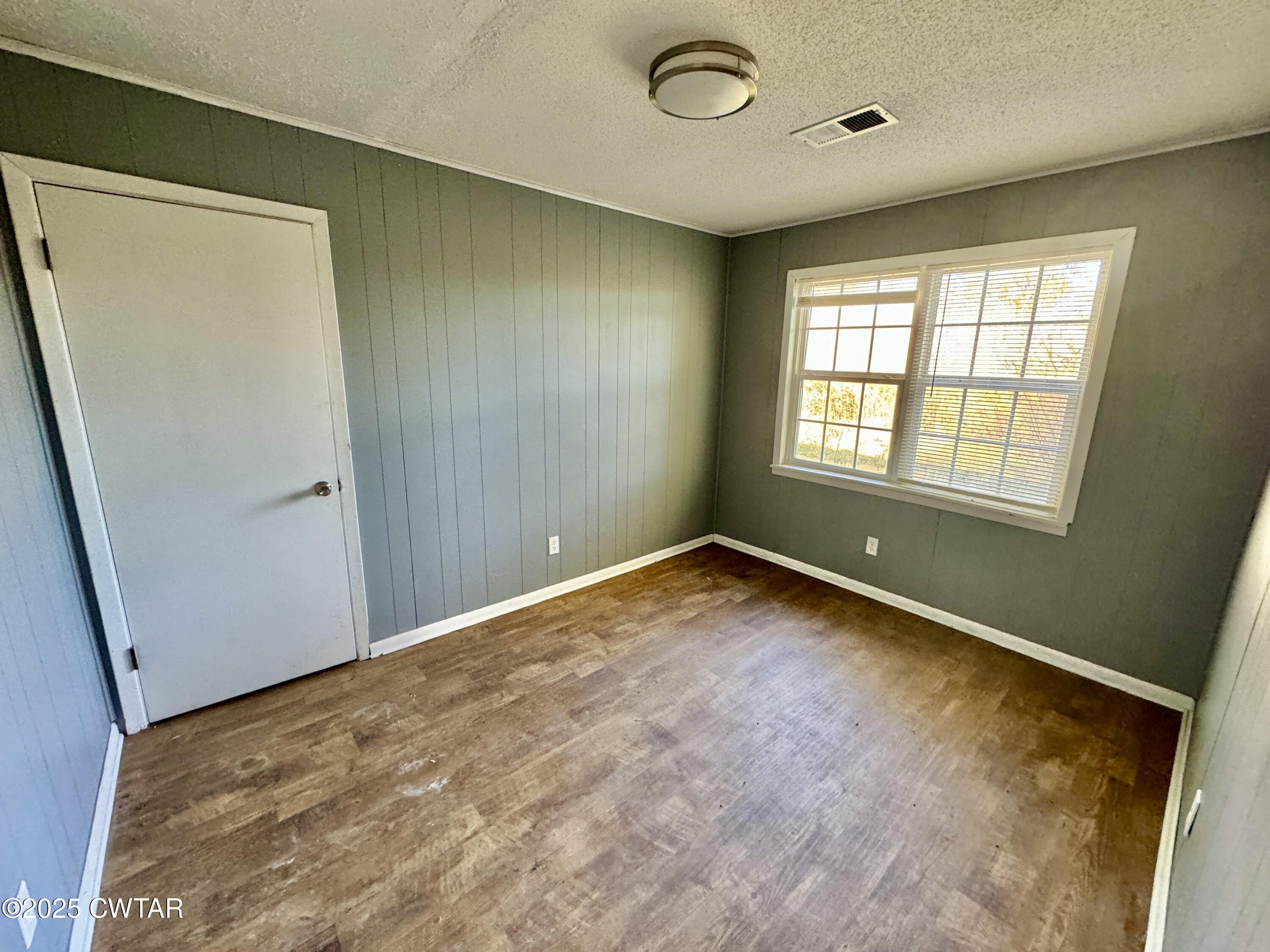 808 Barlow Road Ripley, TN 38063 - Photo 11 of 13 an empty room with a window