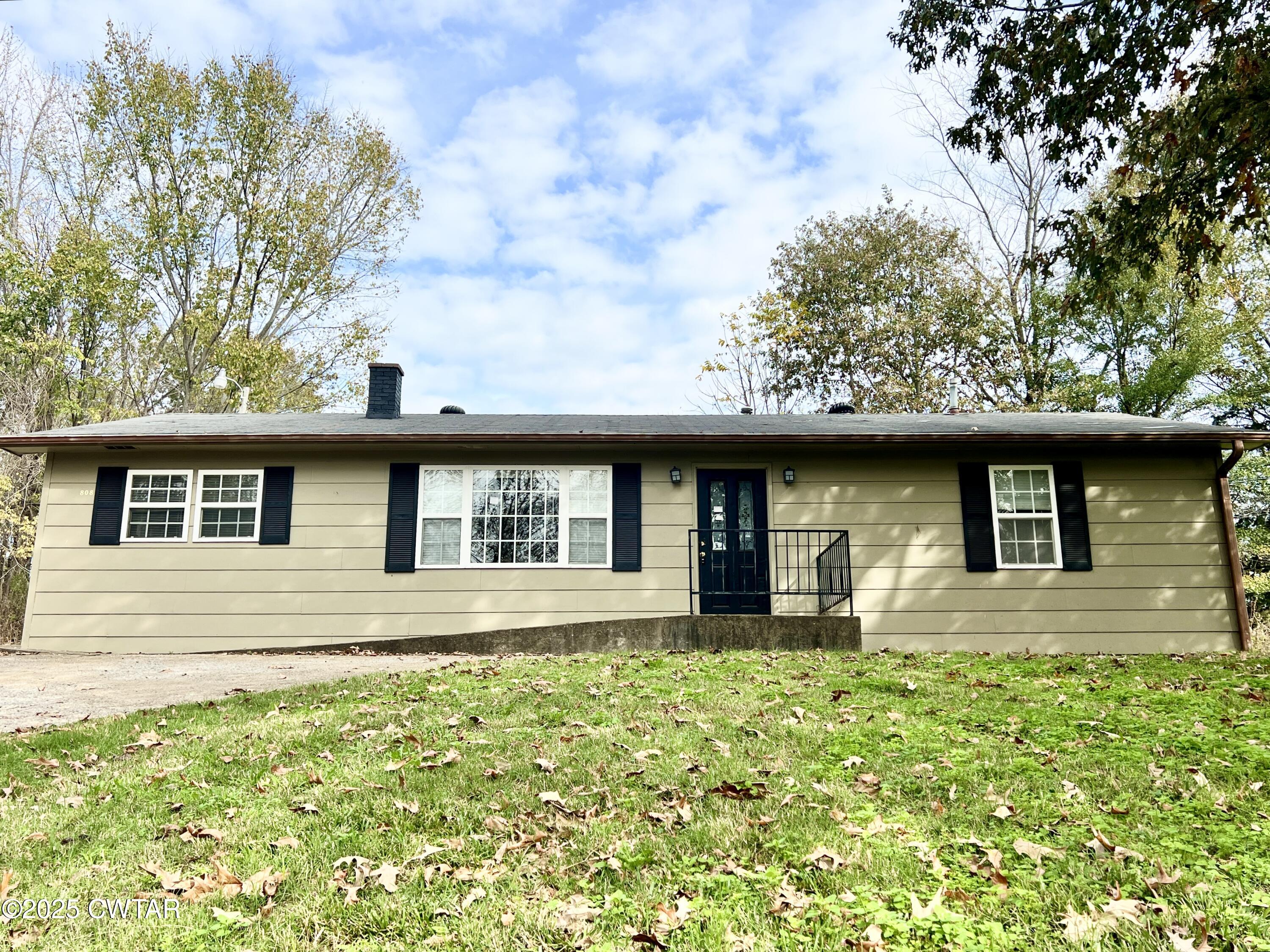 808 Barlow Road Ripley, TN 38063 - Photo 2 of 13 a front view of a house with a garden