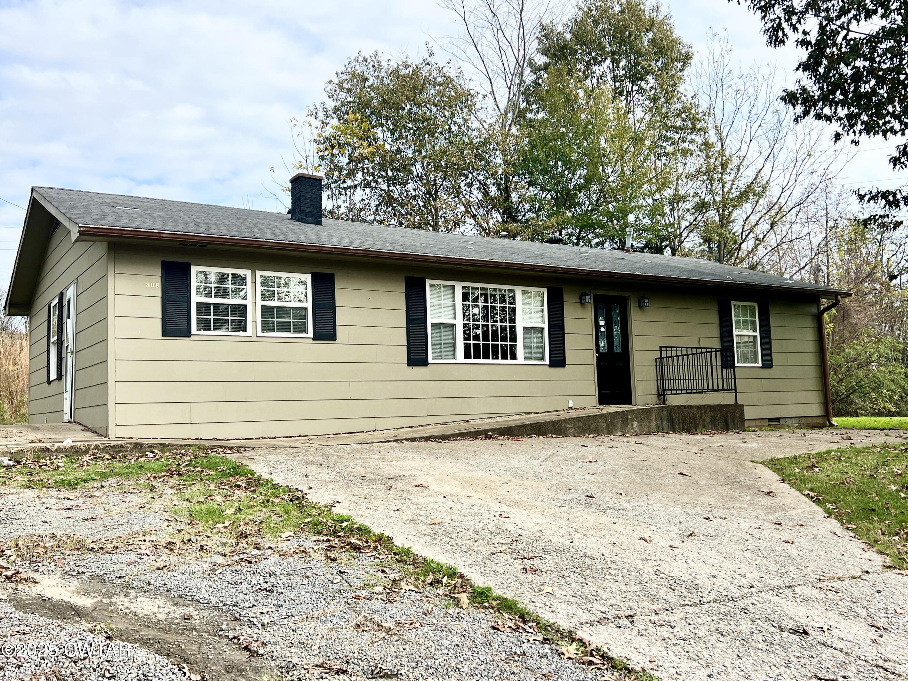 808 Barlow Road Ripley, TN 38063 - Photo 3 of 13 a house with trees in the background