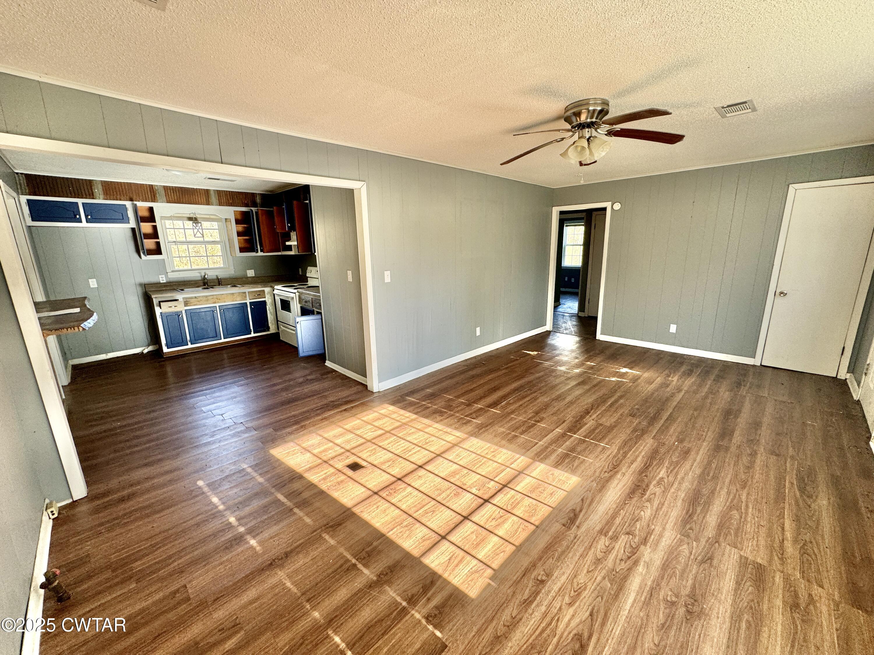 808 Barlow Road Ripley, TN 38063 - Photo 7 of 13 a view of livingroom with furniture and wooden floor