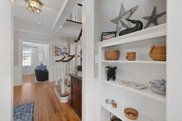 a kitchen with granite countertop white cabinets stainless steel appliances and a counter space