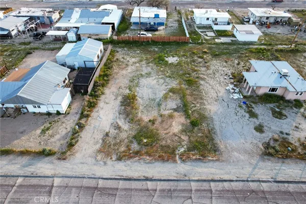 an aerial view of a house with outdoor space