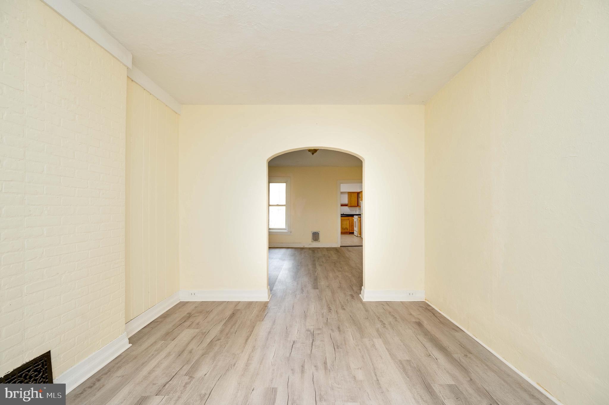 725 Madison Avenue Reading, PA 19601 - Photo 11 of 47 a view of a room with wooden floor and a gate