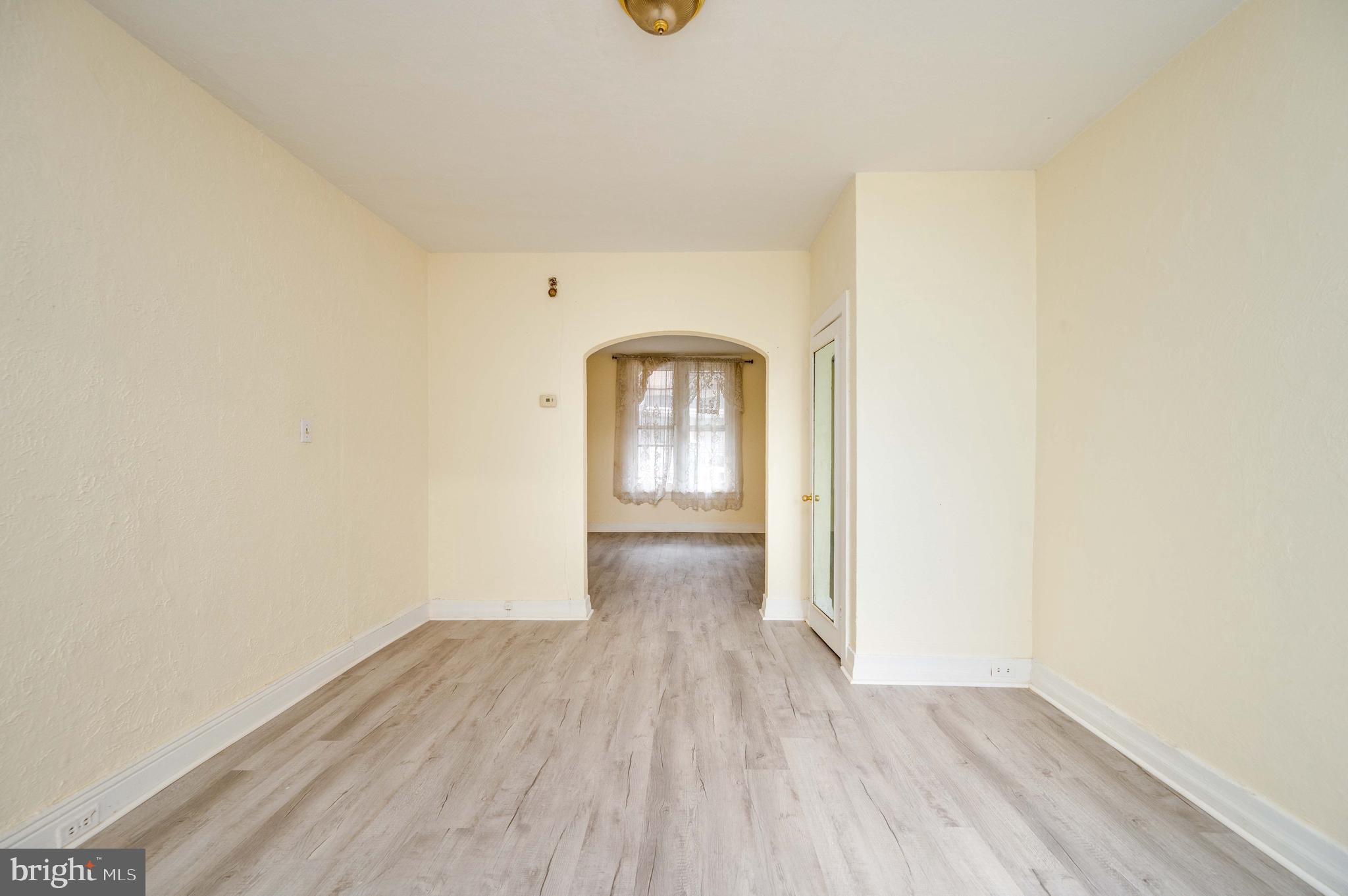 725 Madison Avenue Reading, PA 19601 - Photo 16 of 47 a view of empty room with wooden floor and fan