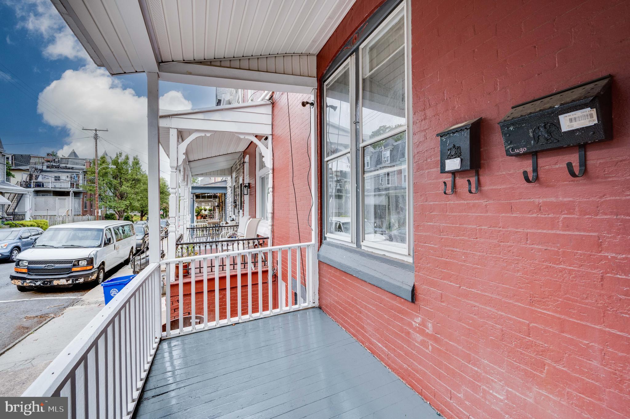 725 Madison Avenue Reading, PA 19601 - Photo 2 of 47 a view of a porch with furniture and a yard