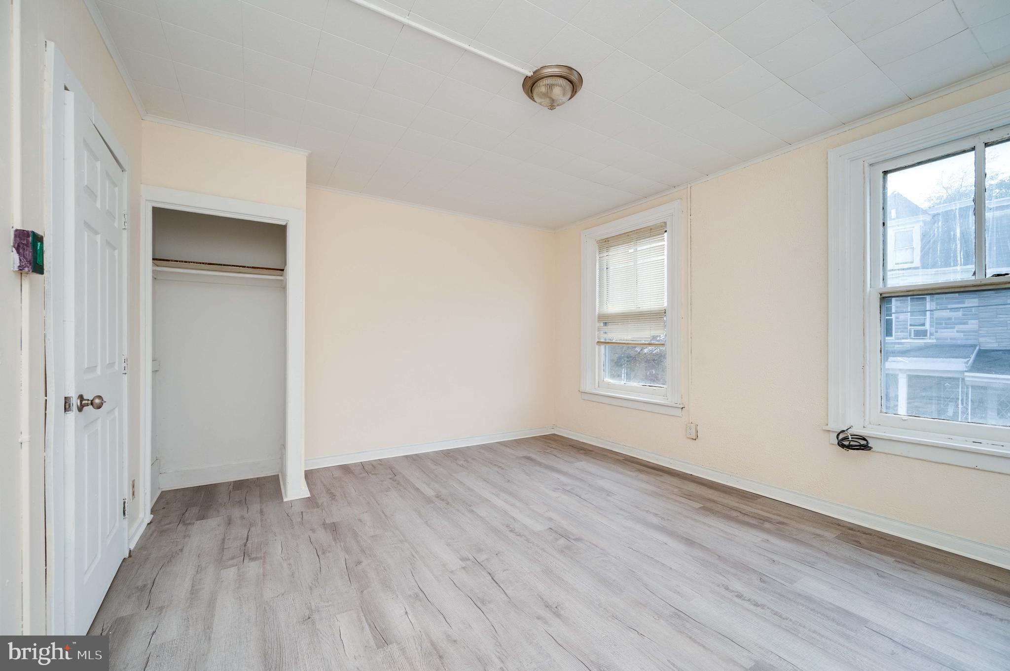 725 Madison Avenue Reading, PA 19601 - Photo 25 of 47 a view of an empty room with wooden floor and a window