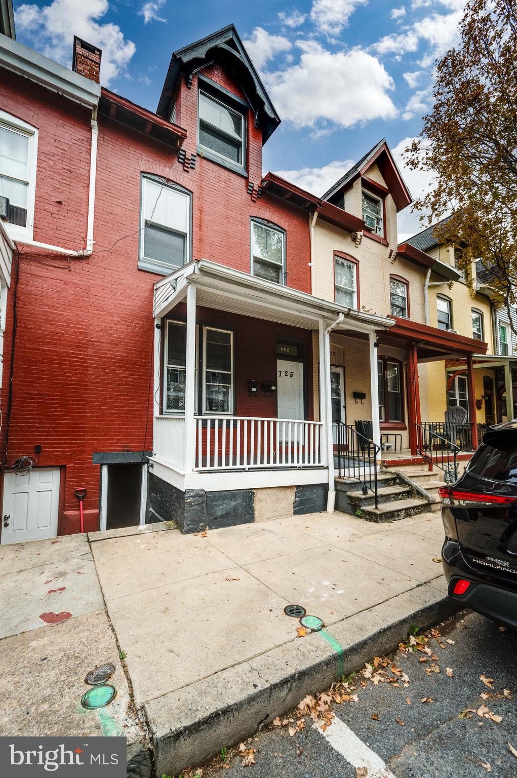 725 Madison Avenue Reading, PA 19601 - Photo 3 of 47 a front view of a house with a yard