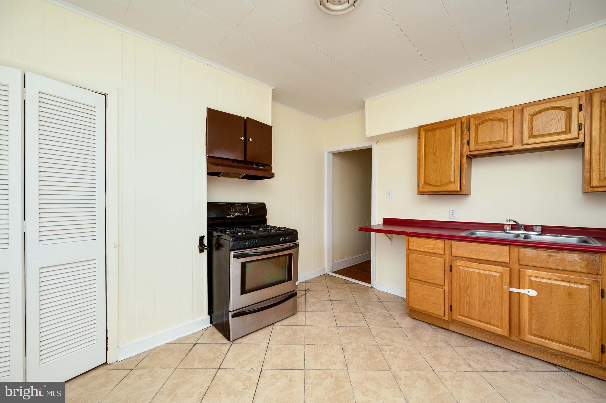725 Madison Avenue Reading, PA 19601 - Photo 35 of 47 a kitchen with stainless steel appliances granite countertop a stove and a sink