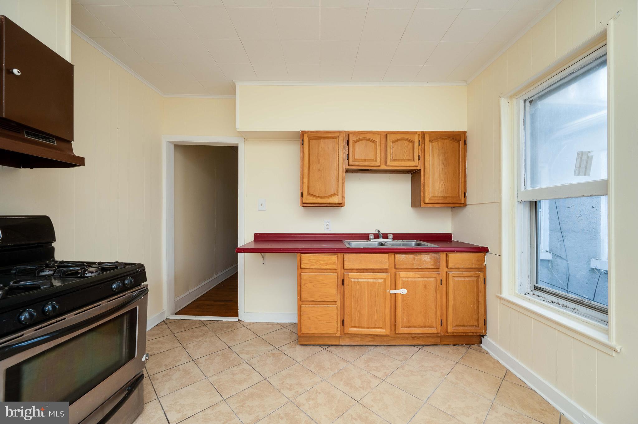 725 Madison Avenue Reading, PA 19601 - Photo 36 of 47 a kitchen with stainless steel appliances granite countertop a stove and a refrigerator