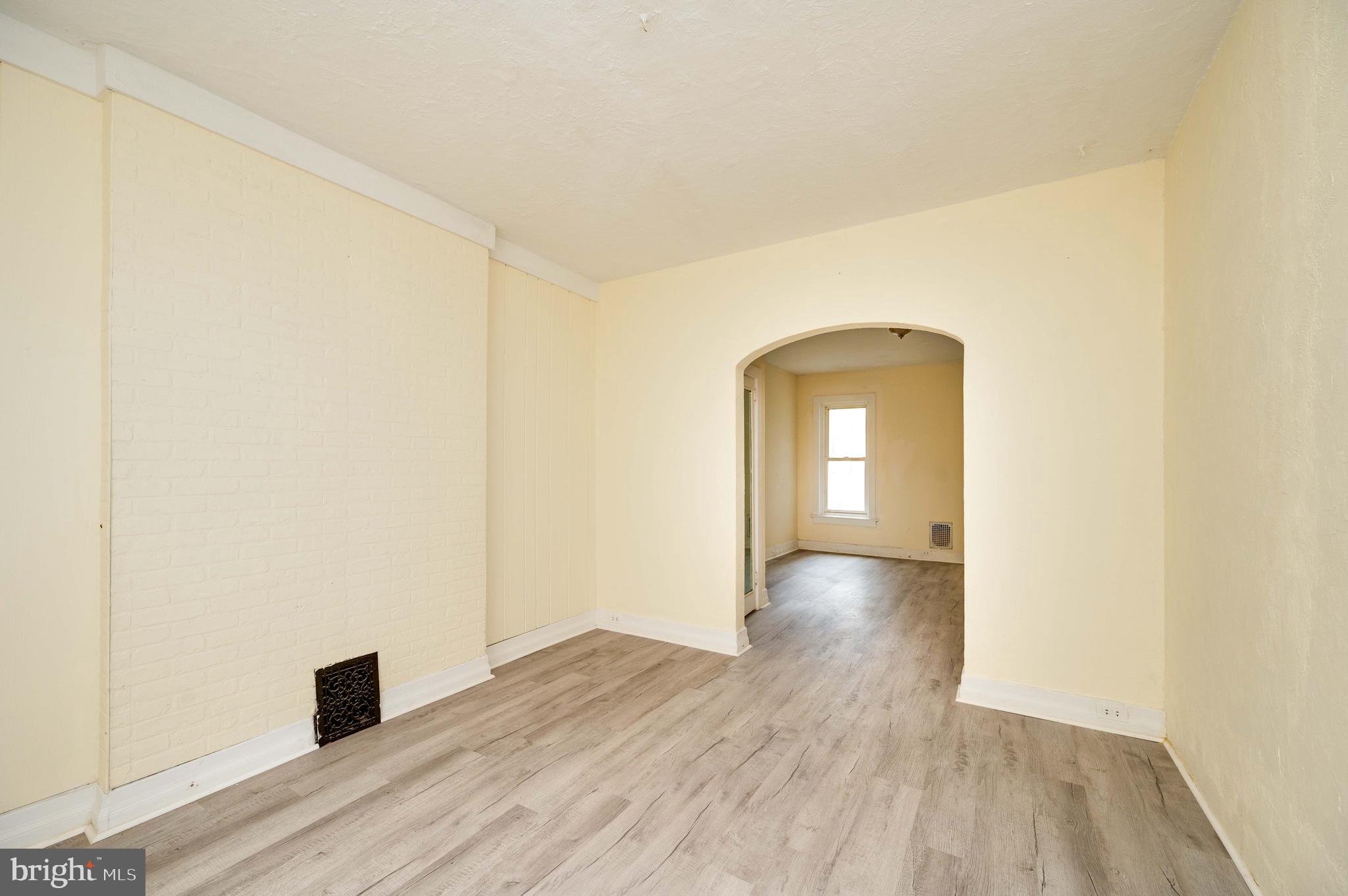 725 Madison Avenue Reading, PA 19601 - Photo 10 of 47 a view of empty room with wooden floor and fan