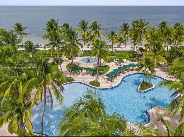 a view of a swimming pool with some plants