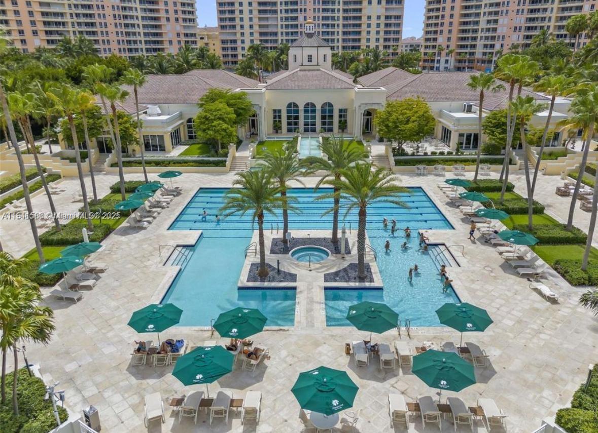 781 Crandon Boulevard, Unit 106 Key Biscayne, FL 33149 - Photo 19 of 20 a front view of a building with garden