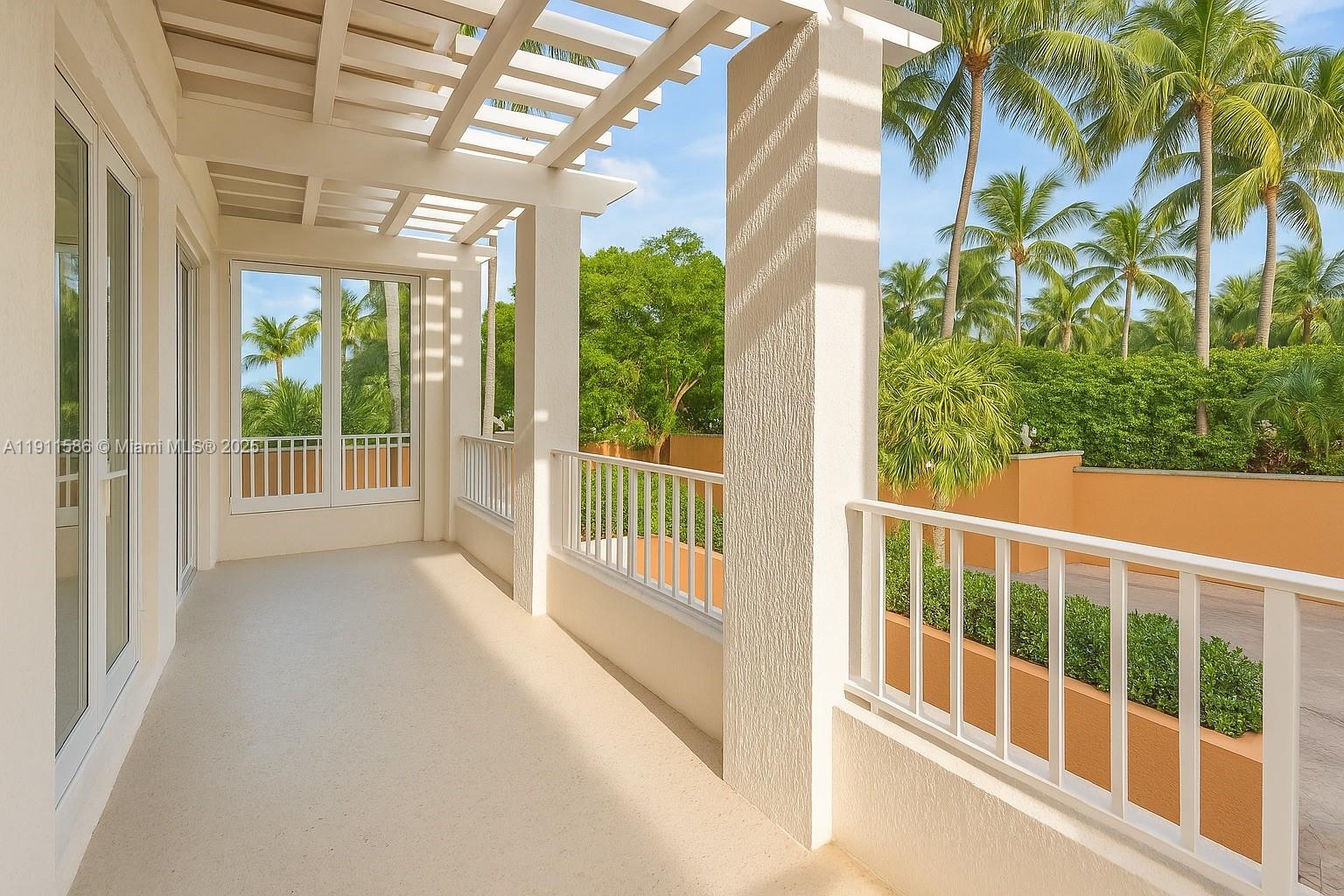 781 Crandon Boulevard, Unit 106 Key Biscayne, FL 33149 - Photo 2 of 20 a view of porch with a small yard