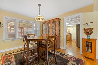 1654 Myers Chapel Road Hayesville, NC 28904 - Photo 11 of 60 a view of a dining room with furniture wooden floor and a chandelier