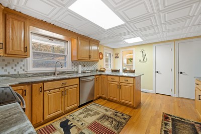 1654 Myers Chapel Road Hayesville, NC 28904 - Photo 16 of 60 a kitchen with granite countertop sink stove and cabinets