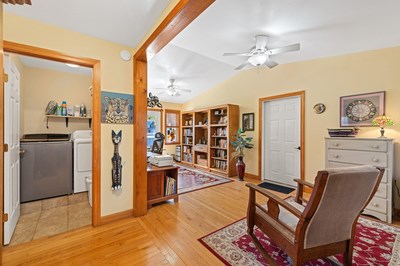 1654 Myers Chapel Road Hayesville, NC 28904 - Photo 19 of 60 a living room with furniture and a chandelier