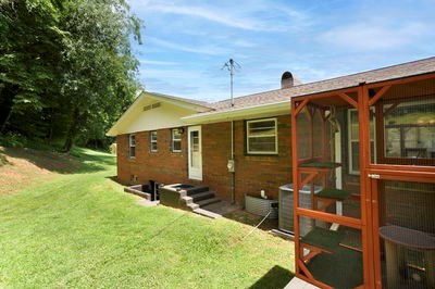1654 Myers Chapel Road Hayesville, NC 28904 - Photo 47 of 60 a backyard of a house with barbeque oven table and chairs