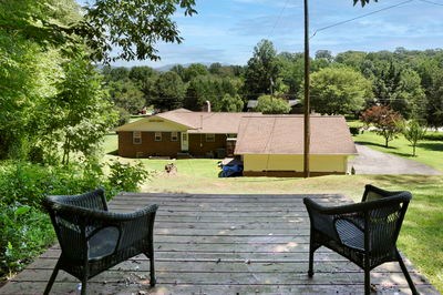 1654 Myers Chapel Road Hayesville, NC 28904 - Photo 50 of 60 a view of a swimming pool with a lounge chair