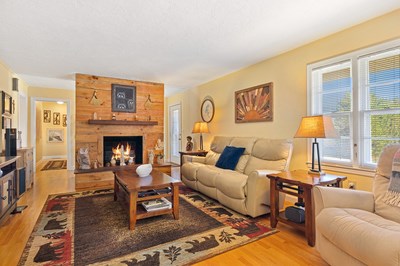 1654 Myers Chapel Road Hayesville, NC 28904 - Photo 6 of 60 a living room with furniture a fireplace and a large window
