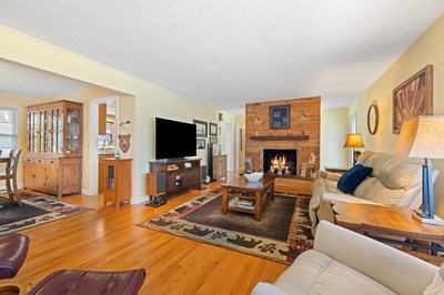 1654 Myers Chapel Road Hayesville, NC 28904 - Photo 7 of 60 a living room with furniture a flat screen tv and a fireplace