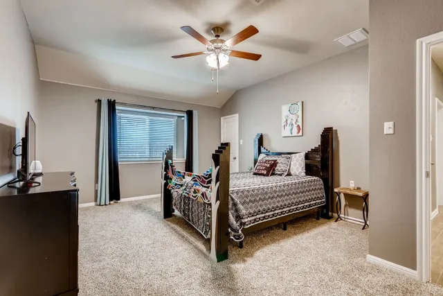 a bed room with bed and window