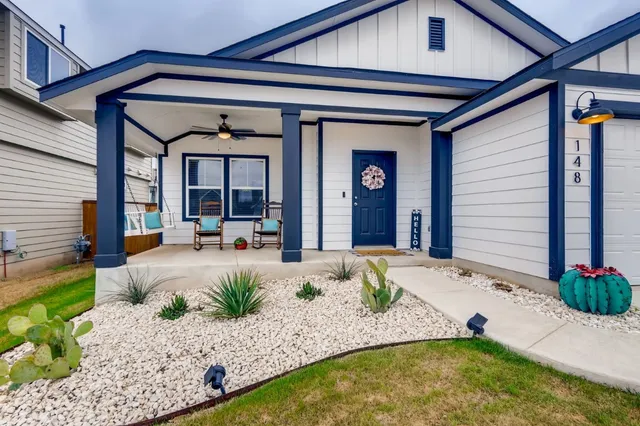 a view of swimming pool with outdoor seating