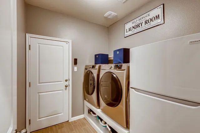 a utility room with dryer and washer