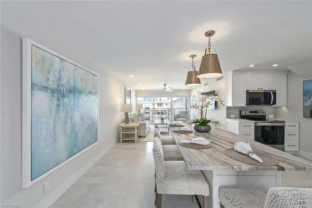 a living room with fireplace furniture and a flat screen tv