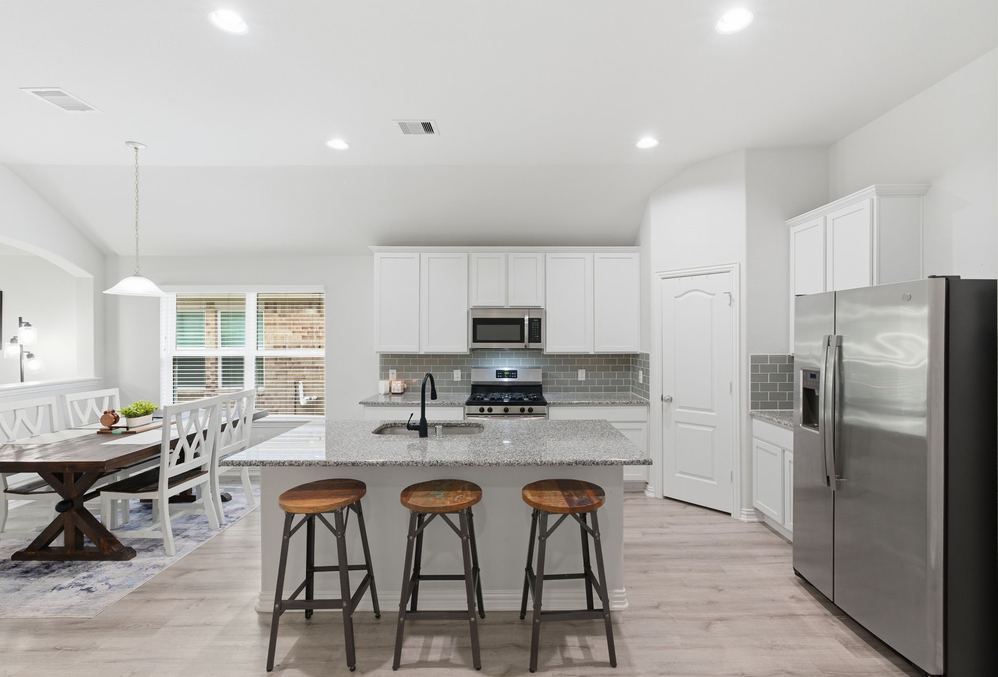 27146 Grey Fox Run Magnolia, TX 77354 - Photo 11 of 44 a kitchen with refrigerator and chairs