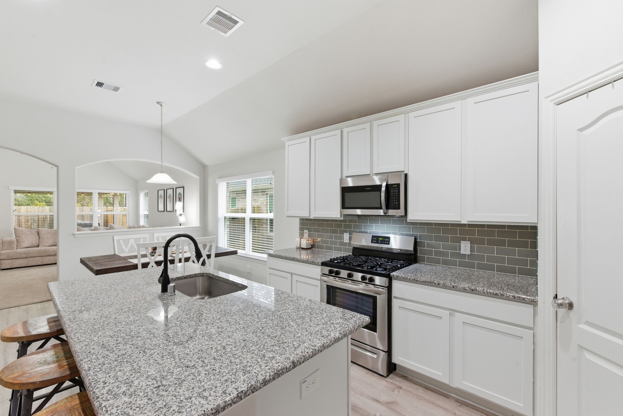 27146 Grey Fox Run Magnolia, TX 77354 - Photo 12 of 44 a kitchen with sink a stove and cabinets