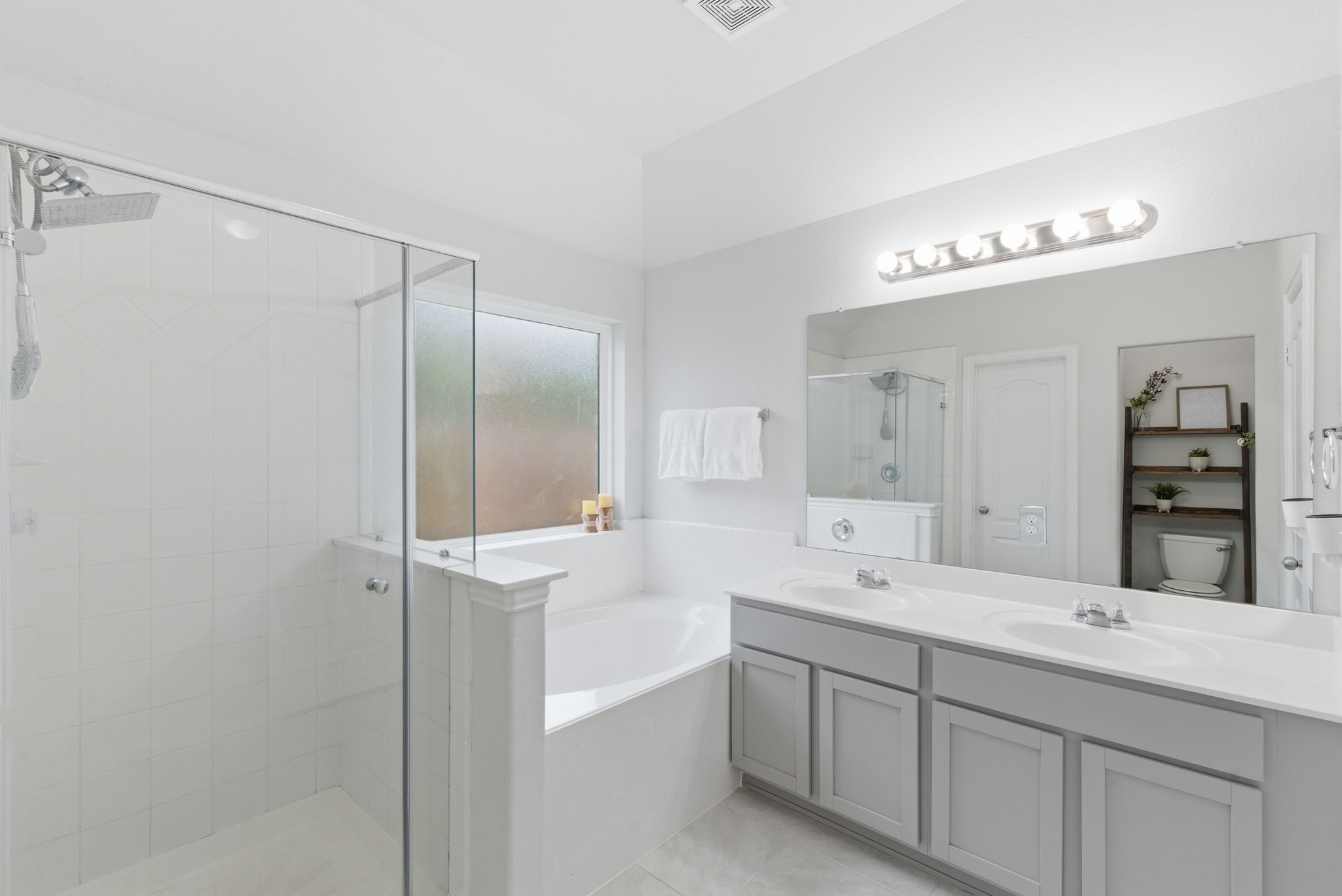 27146 Grey Fox Run Magnolia, TX 77354 - Photo 22 of 44 a bathroom with a double vanity sink mirror and double