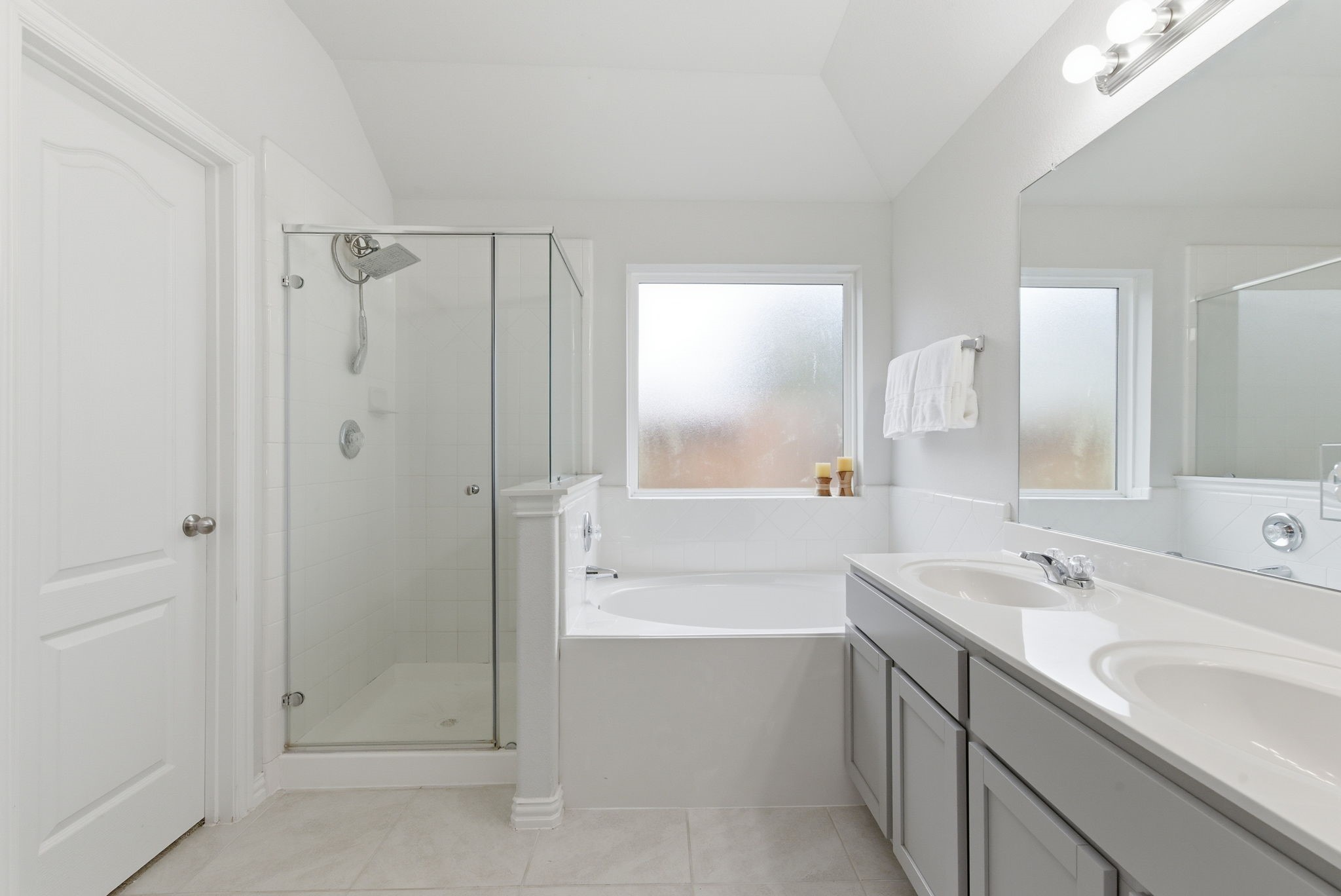 27146 Grey Fox Run Magnolia, TX 77354 - Photo 24 of 44 a bathroom with a shower sink vanity and mirror